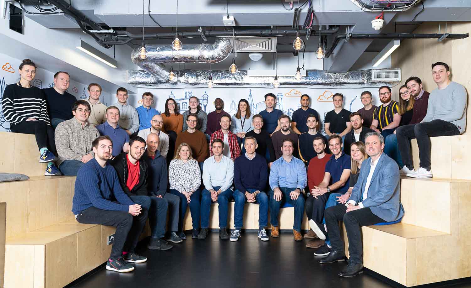 Corporate team photographed together at an event