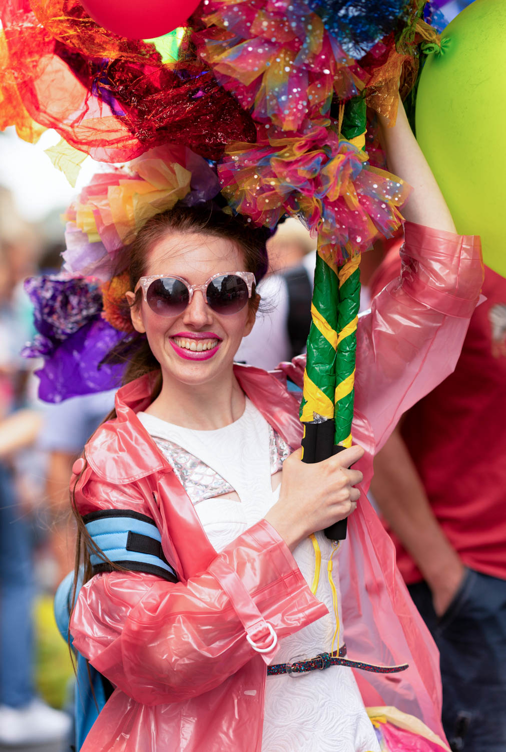 Portrait of a festival-goer in colourful costume at a Pride parade